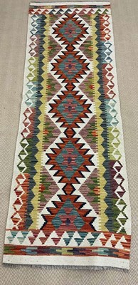 Lot 441 - A handmade wool Chobi Kilim runner, 197 x 67cm
