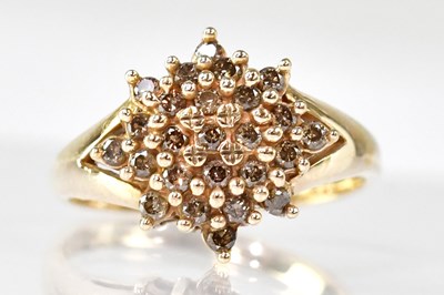 Lot 1096 - A 9ct gold tiny diamond cluster ring, with...