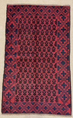 Lot 442 - A handmade wool Baluchi rug, 146 x 90cm