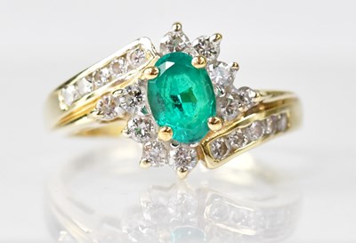 Lot 1084 - A 14ct gold synthetic emerald and diamond...