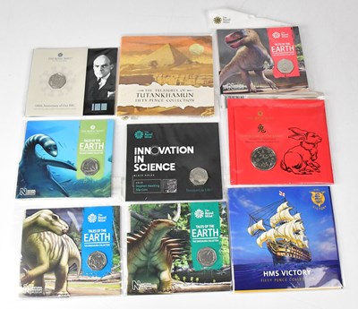 Lot 1020 - THE ROYAL MINT; nine sealed fifty pence...