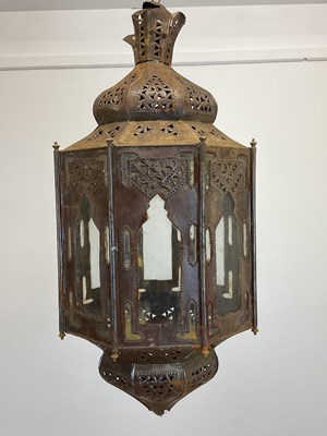 Lot 460 - A Moroccan pierced octagonal metal and glass...