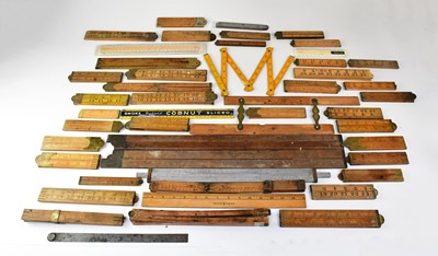 Lot 593 - A quantity of vintage rulers and measuring...