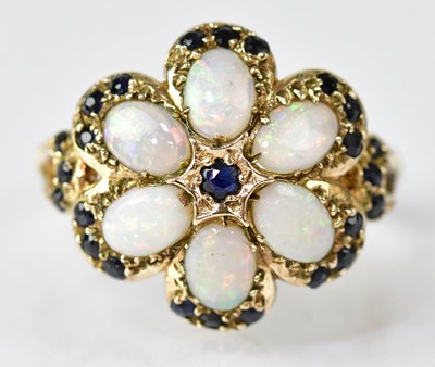 Lot 744 - A 9ct gold ring, the central star set sapphire...