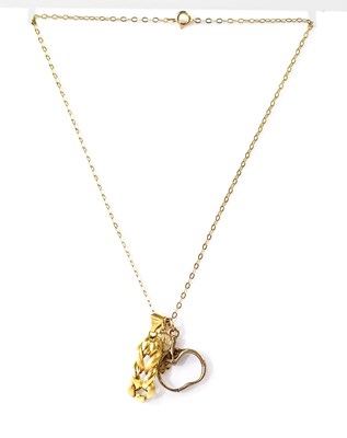 Lot 1193 - A 9ct gold necklace with three-link pendant,...