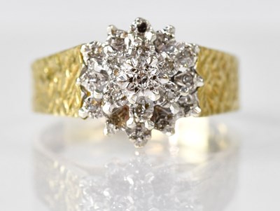 Lot 1083 - An 18ct gold tiny diamond cluster ring in...