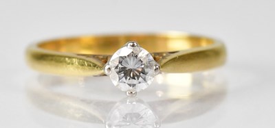 Lot 1078 - An 18ct gold diamond solitaire ring, the claw...