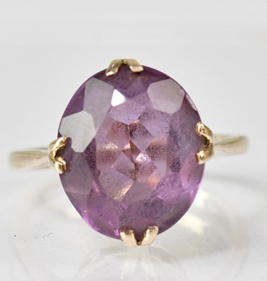 Lot 1100 - A 9ct gold amethyst set dress ring, size O,...