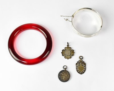 Lot 1158 - A hallmarked silver hinged bracelet with...