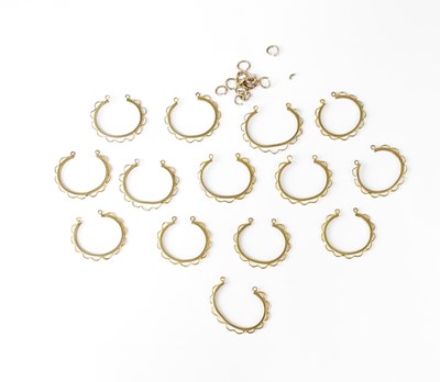 Lot 1240 - Fourteen 9ct gold coin mounts and fourteen cut...