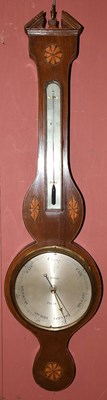 Lot 1361 - A Georgian inlaid mahogany wheel barometer,...