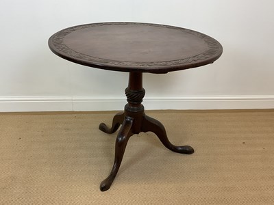 Lot 518 - A 19th century mahogany tilt-top table with...