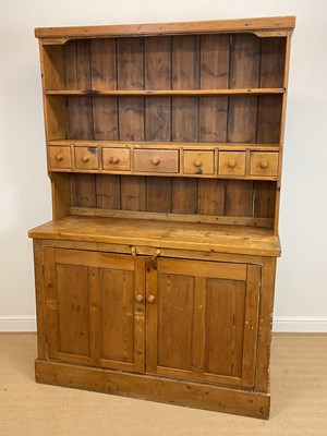 Lot 476 - A pine dresser with seven drawers and two door...
