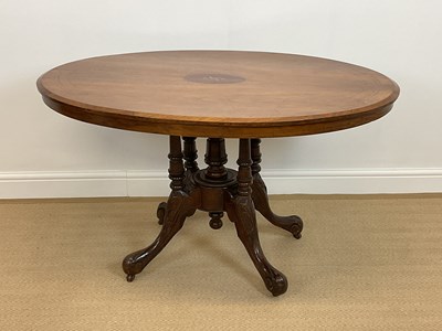 Lot 554 - A 19th century oval tilt-top table with...