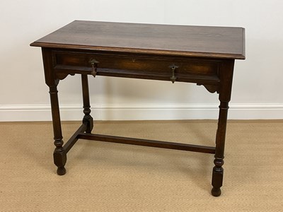 Lot 525 - A 19th century oak writing desk with a single...