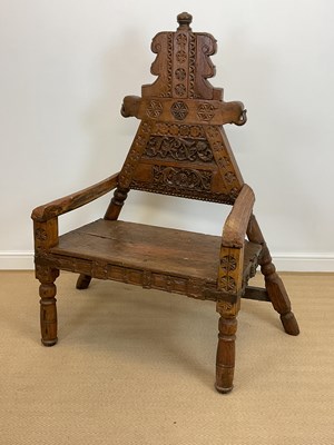 Lot 506 - A large carved rustic seat, height 160cm,...