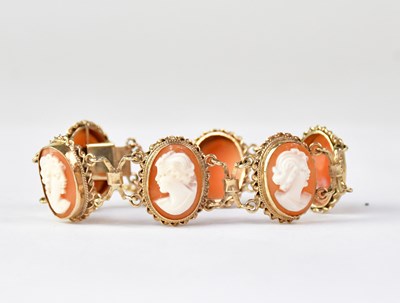 Lot 1135 - A 9ct gold cameo bracelet with six bezel set...