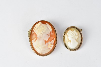 Lot 1174 - Two 9ct gold bezel set cameo brooches, the...