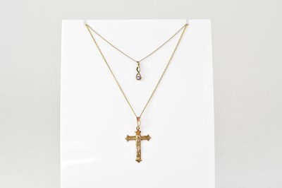 Lot 1203 - A 9ct gold cross pendant, length 3.2cm, on a...