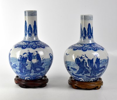 Lot 430 - A pair of Oriental blue and white baluster vases