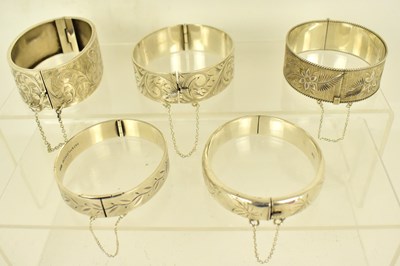 Lot 1162 - Five hallmarked silver hinged bracelets with...