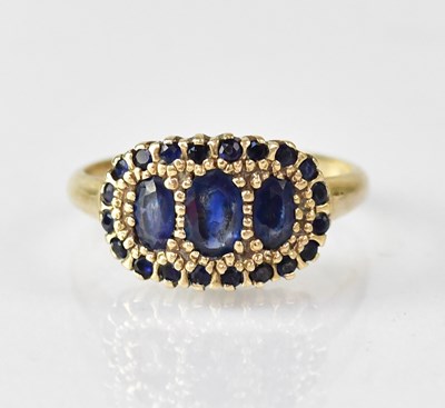 Lot 1097 - A 9ct gold sapphire ring, the table set with...