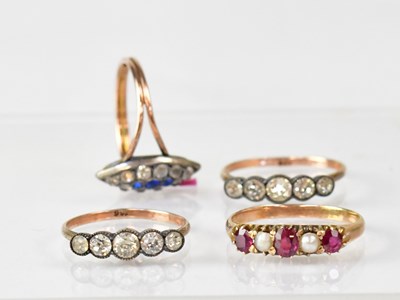 Lot 1129 - Four 9ct gold dress rings, one with ruby and...