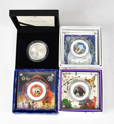 Lot 1019 - THE ROYAL MINT; three silver proof fifty pence...