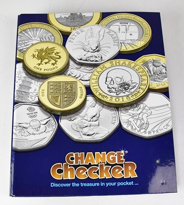 Lot 988 - CHANGE CHECKER; an album comprising £1 coins...