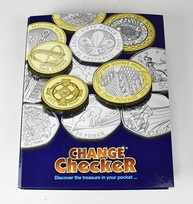 Lot 989 - CHANGE CHECKER; an album of fifty pence coins,...