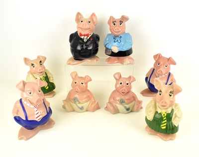 Lot 566 - Eight NatWest pig money banks comprising 'Sir...