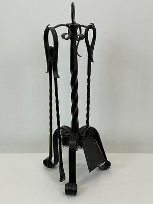 Lot 106 - A contemporary forged steel fireside companion...