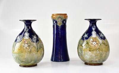 Lot 519 - ROYAL DOULTON; a pair of Art Nouveau stoneware...