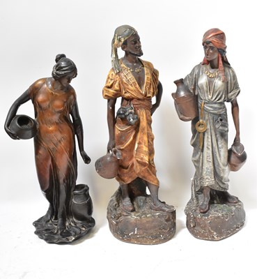 Lot 564 - Three painted plaster Eastern figures of water...