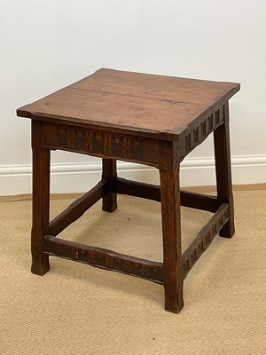Lot 569 - An oak square side table with carved detail...