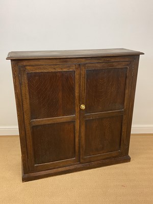 Lot 530 - An oak cupboard with three internal shelves,...