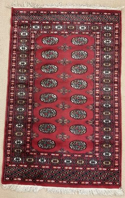 Lot 452 - A Persian rug decorated with medallions to the...