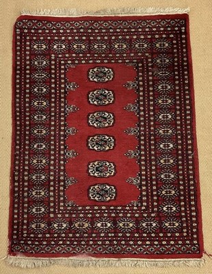 Lot 453 - A Pakistani hand knotted carpet with a dark...