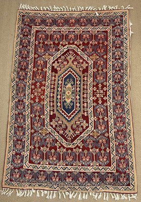Lot 454 - A wall hanging Kasak rug, the central design...