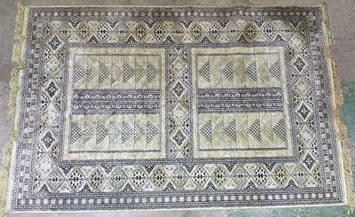 Lot 456 - A decorative rug with a central design of two...