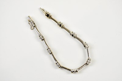 Lot 406 - An 18ct white gold diamond line bracelet...