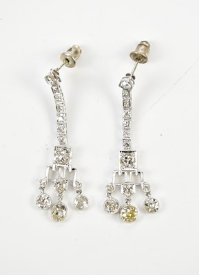 Lot 311 - A pair of white metal Art Deco diamond drop...