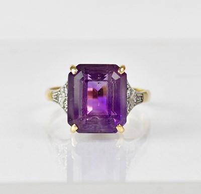 Lot 1067 - An 18ct gold ring with claw set square cut...