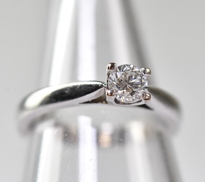 Lot 1065 - An 18ct white gold with claw set brilliant cut...