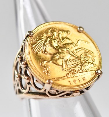 Lot 1106 - A George V 1915 half sovereign ring, George...