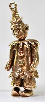 Lot 1180 - A 9ct gold reticulated clown pendant, length 3....