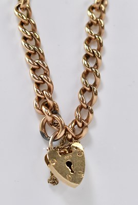 Lot 1140 - A 9ct rose gold curb bracelet with 9ct gold...