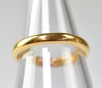 Lot 1060 - A 22ct gold wedding band, size L, approx. 3.1g.