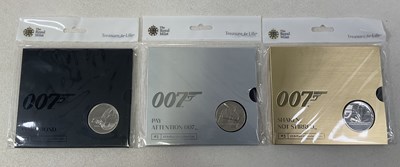 Lot 399 - ROYAL MINT; three James Bond £5 Uncirculated...