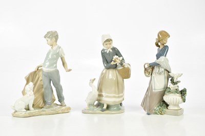 Lot 2824 - LLADRO; two figures comprising a maiden with...